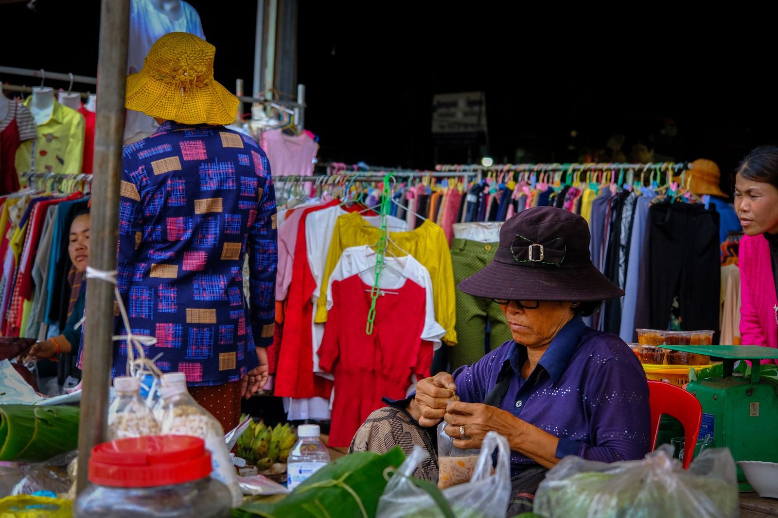Travelers and vendors at a market in Siem Reap Cambodia